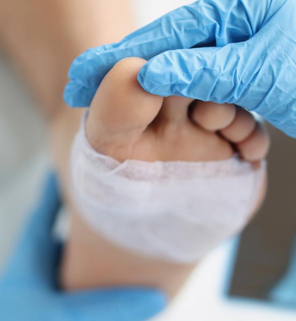 advanced wound care on a patient's foot