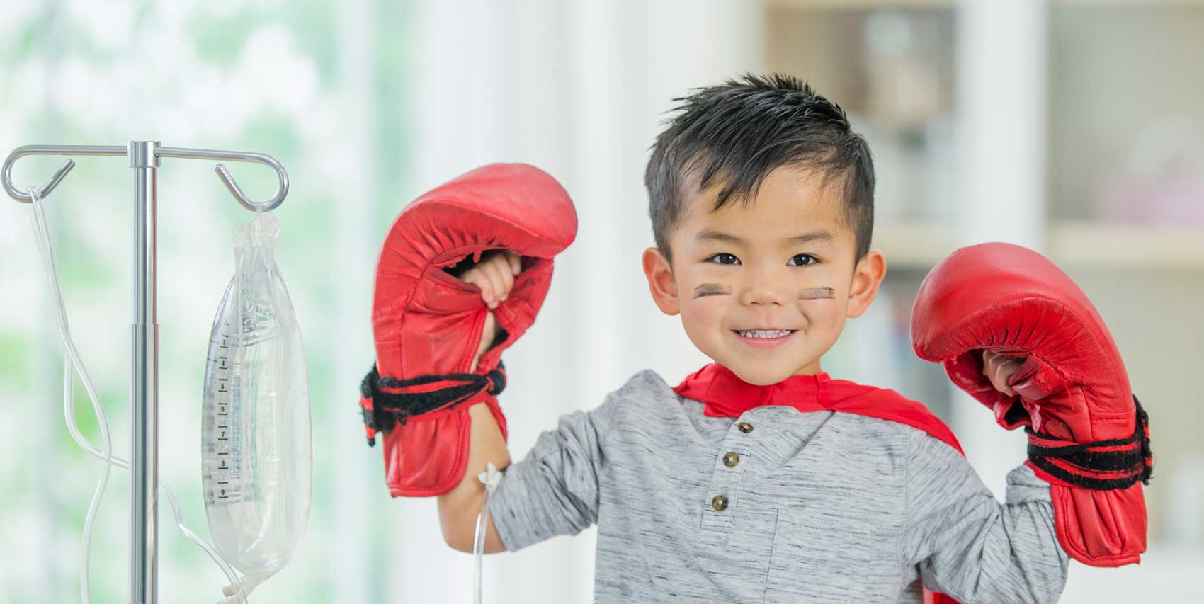 Child with Boxing Gloves on.